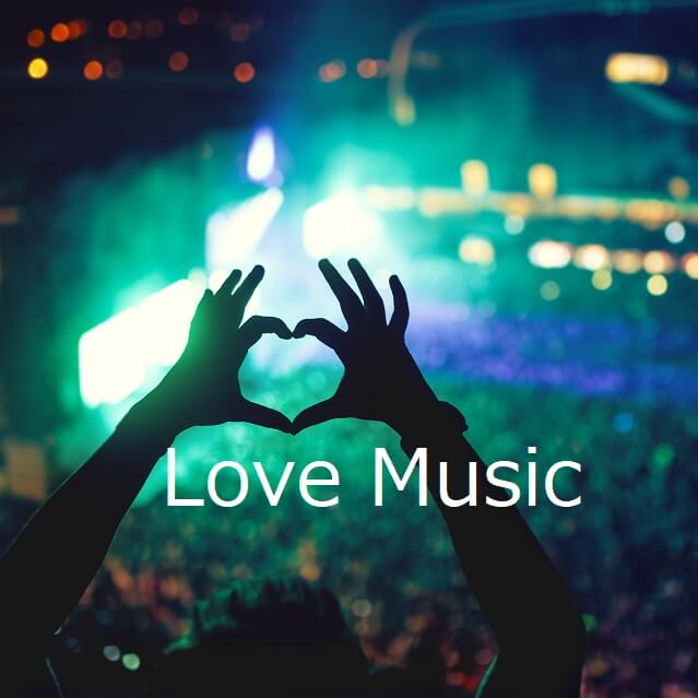 音楽の野外ステージで指でハートを作っている様子。Love Music。